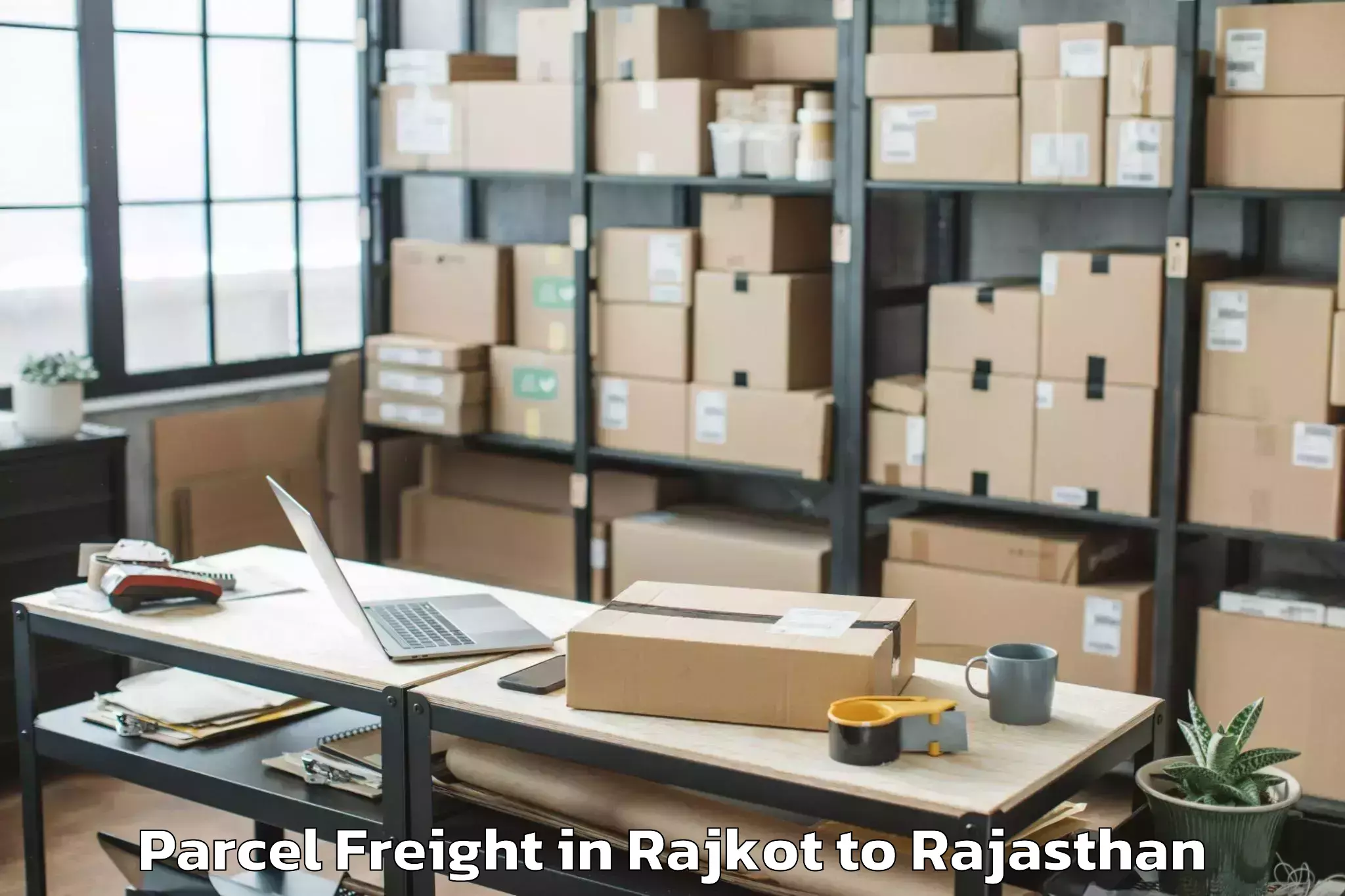 Affordable Rajkot to Raffles University Neemrana Parcel Freight